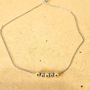 Gold and silver beaded necklace